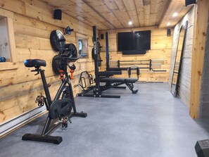 Full Gym. Barbell and specialty bars, dumbbell, functional trainer, mats, bike.