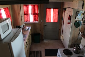 Kitchen view from stairs heading to bed