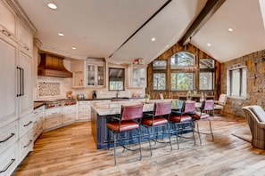 Experience culinary bliss in the fully equipped gourmet kitchen with premium appliances and a spacious island for meal prep. Perfect for creating unforgettable meals with loved ones.