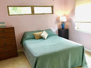 Master bedroom with queen size bed.