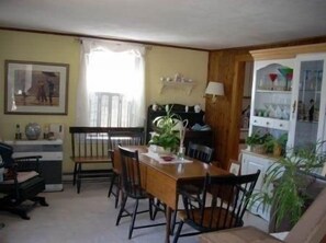 Dining room table folds open so the family can all dine together.