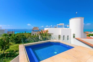 Cancun and sunset views from heated rooftop pool