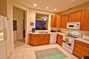 Gourmet Kitchen w Refrigerator / Freezer, Ice Maker, Oven, Microwave, Disposal and Dishwasher