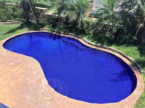 Private Blue Tiled Pool with Limestone Deck