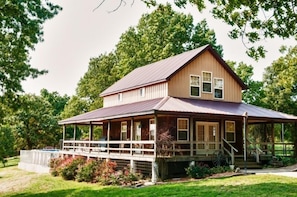 The lodge with the swimming pool in the back.