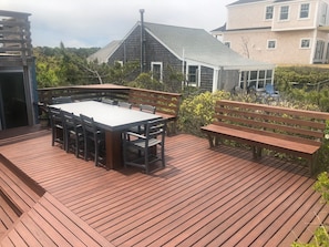 expansive decks also include an upper  seating area 