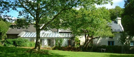 Looking up to the house from the woods and the riv