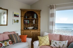 Comfy sleeper couch and antique furniture.
