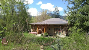 View from driveway to front of the house , Toad mountain in background.