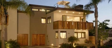 View of the house with the roof top deck.