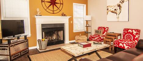 Cozy living room with fireplace.  Enjoy your music with our Bluetooth sound bar.