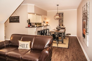 Open plan living room leads to dining room.