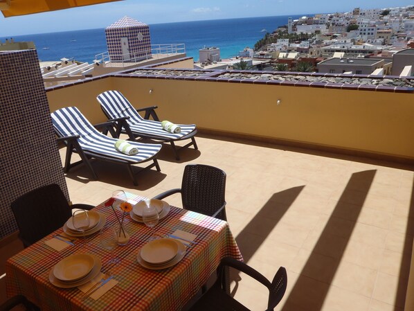 Large sunny terrace overlooking the sea and village 
