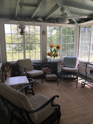 Three season sunroom. Waterview & view of volleyball court. Painted 5.2023