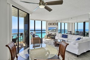 Large floor-to-ceiling windows in the living room provide for unparalleled views of the sparkling Emerald Gulf