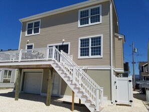 Rear of home.  There will be lounge chairs with cushions. 