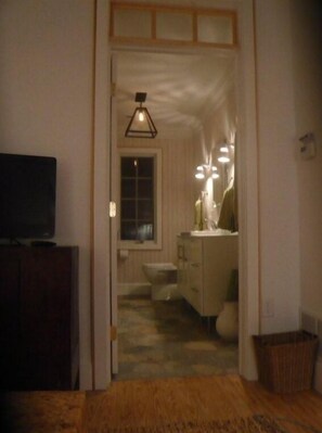 bathroom has tub with shower