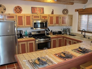 The kitchen has updated appliances and a breakfast bar.