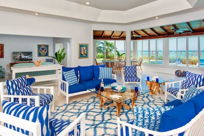 Spacious open living/dining/TV areas fronted by Caribbean Sea