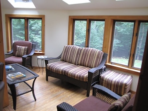 Sun room: natural lighting w/ skylights, open seating, views, hardwood floors...