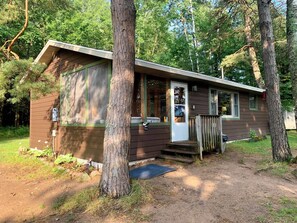 Another view of the cabin featuring the screened in porch.