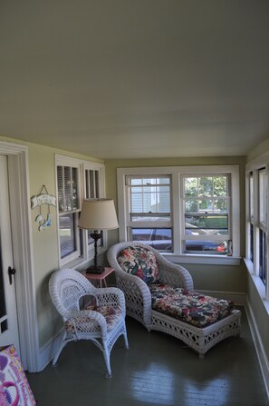 Cozy front porch. Relax after a day of sunning on the beach/fishing at the pier.