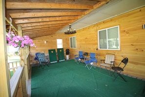 Large Covered front Porch with Seating and Yard Games