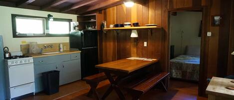 Cabins are fully equipped with kitchen, linens, private bedroom, and deck.