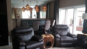 main great room recliner chairs with dining area behind