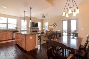 Corner unit with open concept living, dining and kitchen area and windows on two walls. This is the largest living area available in a Base Camp 2bd/2ba unit.