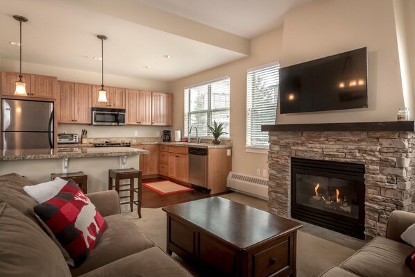 Corner unit with open concept living, dining and kitchen area and windows on two walls. This is the largest living area available in a Base Camp 2bd/2ba unit.
