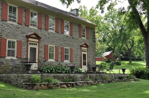 18th century stone house, flagstone terrace - north view