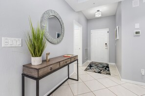 entry with laundry on left