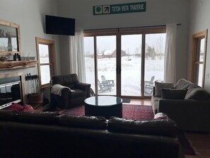 Welcome to Targhee Farmhouse! High ceilings in the living room bring in amazing natural light and view