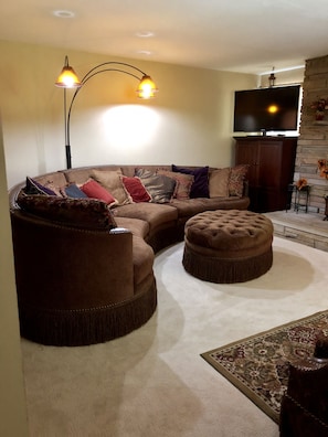 Large comfy couch to lounge in while enjoying cable tv or visiting with family.