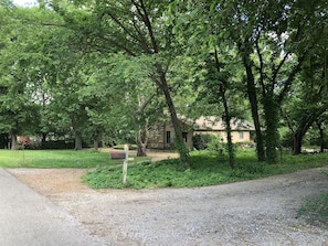 Property surrounded by a field and quiet neighbors with horses on an end street.