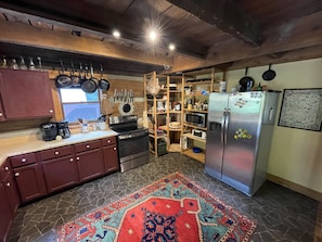 Large, versatile kitchen with new stainless stove/oven and fridge.