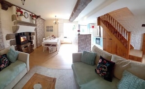 Panoramic view of the lounge, dining area and kitchen