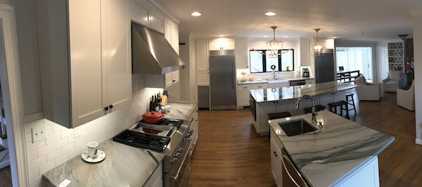 Spacious kitchen with large island and smaller island with prep sink.