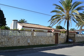 Exterior of our lovely villa in residential, palm tree lined avenue

