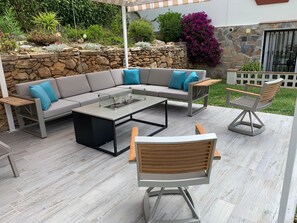 Lovely shady pergola with retractable roof by the pool.  Comfortable seating 
