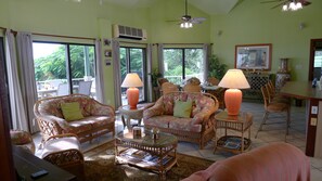 Air-conditioned great room on pool deck level. Master bedrooms on opposite sides