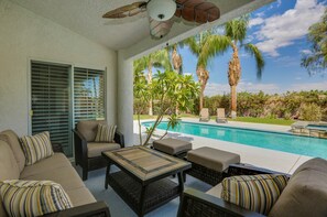 Covered seating area with ceiling fan