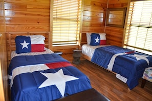 Two single beds in the bedroom; plus 2 fold-out couches in living the room