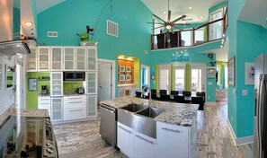 View of Living & Dining Room and two story space.  Dining room seats 10.