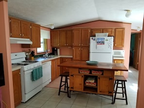 Well equipped kitchen. Kitchen island seats 6.