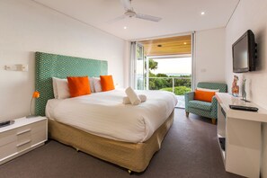 Wake up to sweeping ocean views in this serene primary bedroom with a king bed and ensuite.