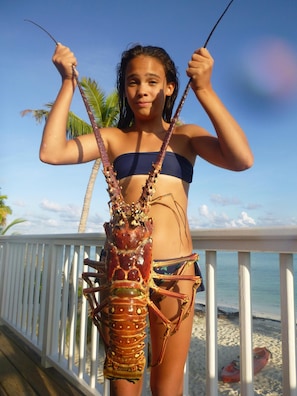 Sofia and a GIANT lobster speared on the reefs at Casuarina Point - August 2015