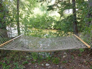 Hammock next to river.