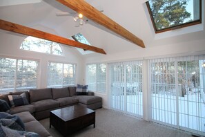 Wonderful sun room with skylights and slider to deck